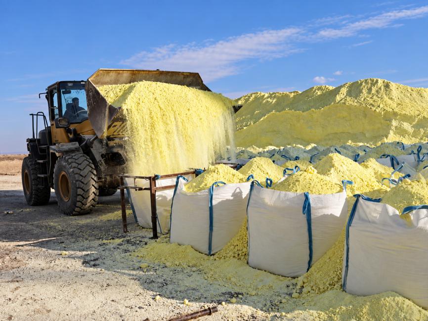 Sulphur being loaded by a wheel loader